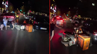 Eşine motosiklet çarptı, çocuğu ölümden dönen adam sinirlerine hakim olamayıp kuryeye böyle saldırdı. O anlar saniye saniye böyle görüntülendi